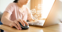 Email marketing concept. Hand using computer sending message with envelope icon