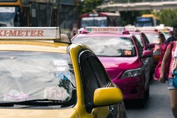 Taxi waiting for passengers in front of Chatuchak market in Bangkok, Thailand