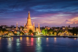 The landscape photo of Wat Arun (The temple of dawn) at twilight time. Wat Arun temple is top tourist destination in Bangkok,  located along the Chao Phraya river in Bangkok, Thailand
