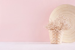 Modern simple art pink home decor with white dried flowers, bamboo dish on soft light white wood table. 