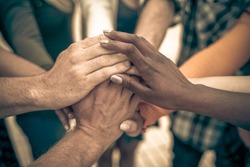 Young people putting their hands together. Friends with stack of hands showing unity and teamwork – Image
