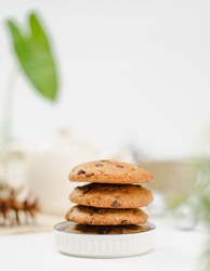Stack of cookies photographed on a white table.