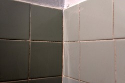 Gray-blue ceramic tiles in the bathroom. Gray tile background. Beautiful abstract grunge decorative wall background.