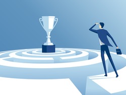 businessman has climbed to the top of the maze and trying to find the way to the cup, worker looks how to get through the maze and get a prize. business concept the way to victory