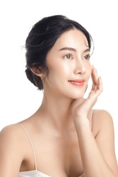 Asian woman with a beautiful face and Perfect clean fresh skin. Cute female model with natural makeup and sparkling eyes on white isolated background. Facial treatment, Cosmetology, beauty Concept.