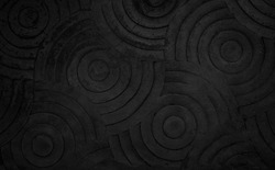 Black concrete texture wall background. Abstract dark paint floor stamped concrete surface clean polished on walkway in garden. Wallpaper cement stone pattern curved circle rough gray decorative room.