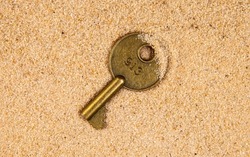 image of key sand background