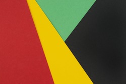 February Black History Month. Abstract Paper geometric black, red, yellow, green background. Copy space, place for your text. Top view.