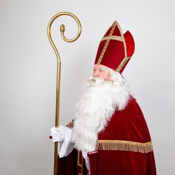 Saint Nicholas with mitre ans staff in profile on white