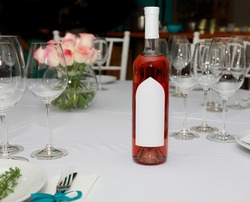 Red wine with wine glasses on the wedding table in the restaurant