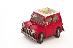 Isolated red vintage toy car.