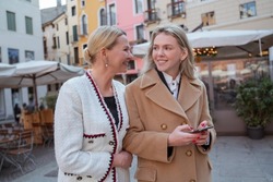 Two female tourists sightseeing in the city center