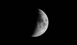 Detailed half moon on black sky