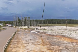 Walking path Fountain Paint Pot Trail in the Yellowstone National Park during stormy weather