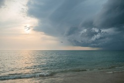 picturesque scenery at the seacoast in evening time, There are air planes and rain clouds in the sky, Phuket, Thailand,