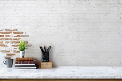 Mock up : Stylish minimalistic white marble table workplace with supplies, house plant. copy space for product display montage.
