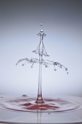 Water drops capture using highspeed photography that form a water sculpture with dancing girl profile