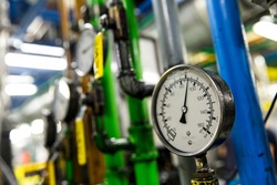 Pressure gauge, measuring instrument close up. Hydraulic pressure gauges installed on hydraulic equipment