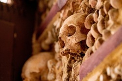 Skull in the wall with a lot of other bones in Faro Portugal
