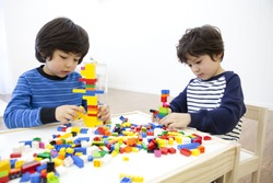 Cute Korean kids playing with lego
