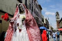 An image of Our Lady of the Holy Death or La Santa Muerte, a Mexican female deity, is seen in a shopping commercial street of downtown Mexico City, Mexico.