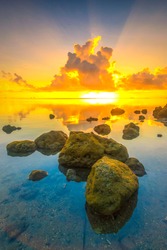good morning sunshine in the beach rock, nongsa sub-districts, batam island, indonesia