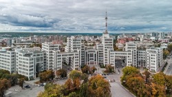 Autumn colorful city aerial panorama on Derzhprom historic constructivist architecture building from Freedom Svobody Square with epic cloudscape in Kharkiv, Ukraine