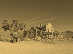 Ruins of the train station in the ghost town of Rhyolite in Death Valley Nevada USA - vintage sepia look