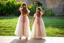 Two little girls dressed in first communion dresses