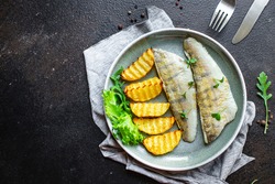 fried fish and potatoes pike perch fish fresh seafood food organic products meal snack copy space food background rustic. top view keto or paleo diet vegetarian food pescetarian diet