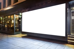 Blank mock up of store street showcase window in a city at night
