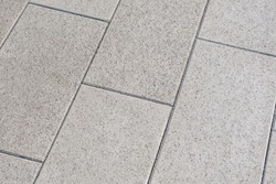 Gray paving slabs, close up. Pattern of paving blocks, top view