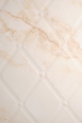 Beige marble textured tiles in the bathroom
