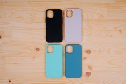 Four silicone smartphone cases. Protective smartphone cases in black, beige, mint and turquoise colors.