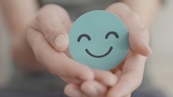 Hands holding green happy smile face, good feedback rating and positive customer review,experience, satisfaction survey,mental health assessment,child feeling good,world mental health day, Compliment 