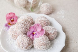  strawberry, date, nuts and coconut bliss ball with edible flowers, keto, ketogenic, low carb diet, sugar free, dairy free and gluten free dessert
