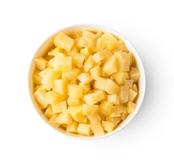 Boiled potatoes, diced in a bowl isolated on a white background. An ingredient for cooking a dish. Top view, close-up.