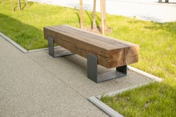 Street wooden bench in perspective, bench in the park. Perspective a wooden bench on the street