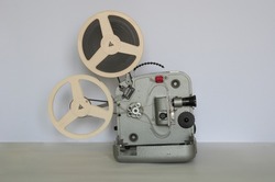 Rare home film projector with 8mm film cassettes. Side view.
