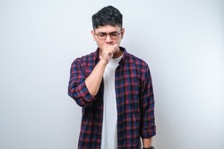 Young asian man wearing casual shirt and glasses coughing with sore throat, concept of man with allergy over white background