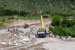 Construction of a bridge in a mountain village. Mountain Digoria. North Ossetia. Russia.