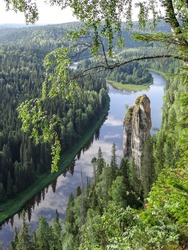 Picturesque rock Chertov Finger and Usva river. View from above. Massif Usvinskiye Pillars. Perm region. Russia                               