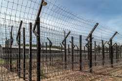 Barbwire elctrical secure frame fence with metal barb electricity wire of the prison.