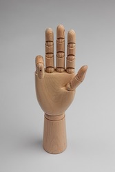 wooden hand bent one finger on white background