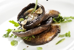 grilled portobello mushrooms, covered in herbs and garlic