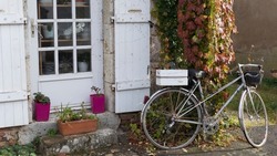 Bike parked against an open doorway
