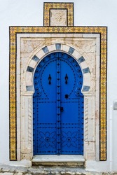 View of the typical front facade of a house in the Mediterranean city of Sidi Bou Said, a town in northern Tunisia located about 20 km from the capital, Tunis