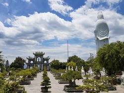 September 2019: Lady Buddha statue at the Linh Ung Pagoda in Danang city in Vietnam.  White Buddha statue on blue sky background. 