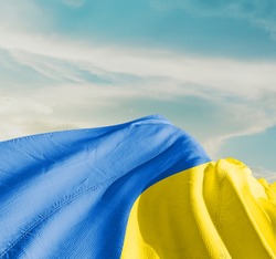 Ukraine waving flag in the sky.