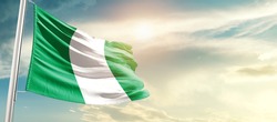 Nigeria national flag waving in beautiful sunlight.